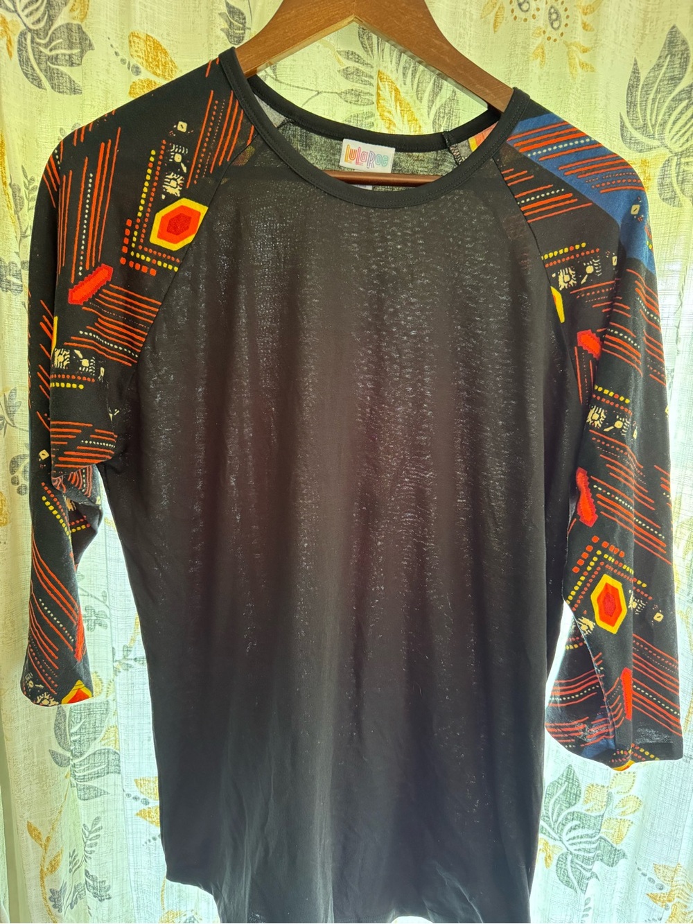 LuLaRoe Black Baseball Tee with Multicolor Geometric Raglan Sleeves